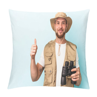 Personality  Young Caucasian Man Looking At Animals Through Binoculars Isolated On Blue Background Smiling And Raising Thumb Up Pillow Covers