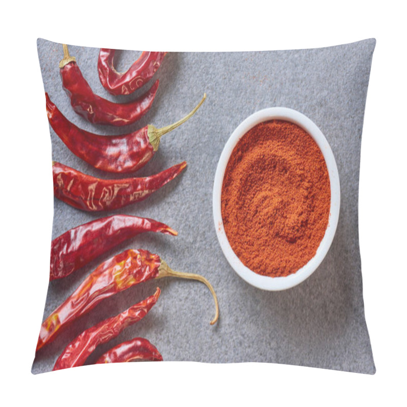 Personality  top view of arranged grinded and wholesome chili peppers on grey tabletop pillow covers