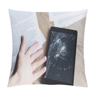 Personality  Cropped View Of Man With Hand Near Smashed Digital Tablet And Documents On Wooden Background Pillow Covers
