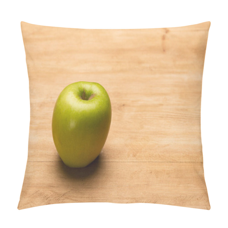Personality  Close up view of green apple on wooden surface pillow covers