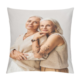 Personality  Joyous Senior Woman With Silver Hair And Tattoo Embracing Fashionable Female Friend On Grey Pillow Covers