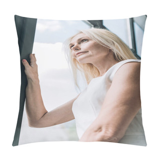 Personality  Low Angle View Of Elegant Blonde Mature Woman Looking Through Window Pillow Covers