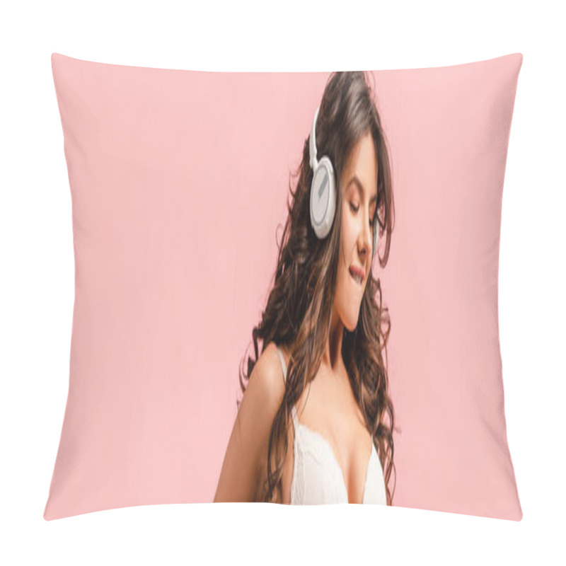 Personality  Panoramic orientation of sexy girl with headphones biting lip isolated on pink pillow covers