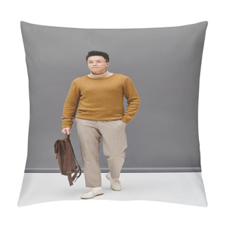 Personality  A Stylish Young Man In A Brown Sweater And White Pants Poses Confidently. Pillow Covers