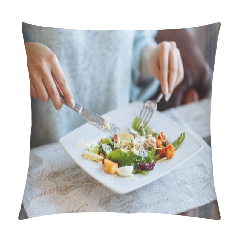 Personality  Woman's hands with Caesar salad on table in restaurant pillow covers