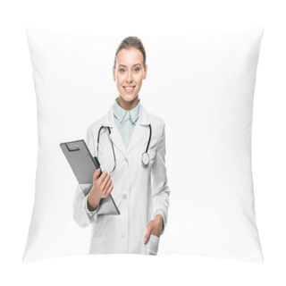 Personality  Cheerful Young Female Doctor In Medical Coat Holding Clipboard Isolated On White Pillow Covers