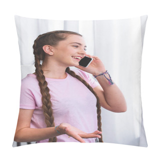 Personality  Side View Of Smiling Teenage Girl With Plaits Gesturing By Hand And Talking On Smartphone In Front Of Curtains At Home Pillow Covers