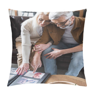 Personality  Elderly Couple Looking At Photos In Album On Couch Pillow Covers