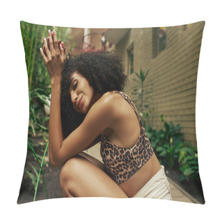 Personality  Smiling African American Curly Woman In Chic Attire Strikes A Pose Near Building With Green Plants Pillow Covers