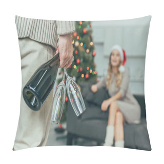 Personality  Cropped Shot Of Man With Champagne Glasses Standing In Front Of Woman In Santa Hat Sitting On Couch At Home On Christmas Pillow Covers