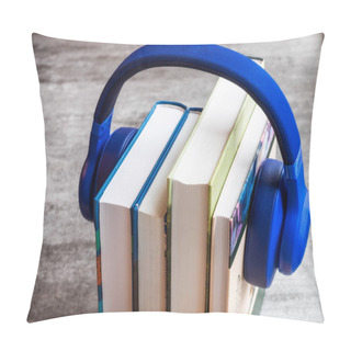 Personality  Concept Of Audiobook. Books On The Table With Headphones Put On Them Pillow Covers