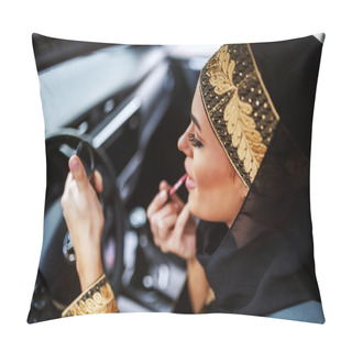 Personality  Gorgeous Attractive Young Muslim Woman In Traditional Wear Sitting In Her Car During Traffic Jam And Putting On Lipstick. Pillow Covers
