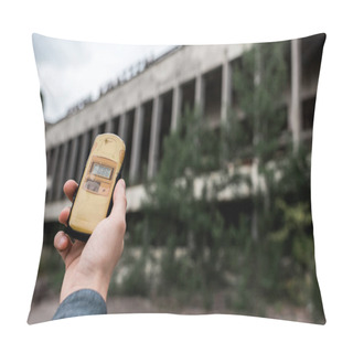 Personality  PRIPYAT, UKRAINE - AUGUST 15, 2019: Cropped View Of Man Holding Radiometer Near Building In Chernobyl  Pillow Covers
