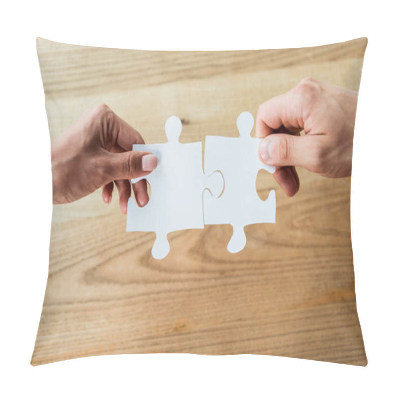 Personality  cropped view of african american woman and man holding jigsaw puzzle pieces  pillow covers