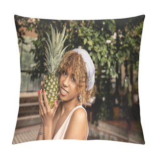 Personality  Smiling Young African American Woman With Braces And Headscarf Holding Fresh Pineapple And Looking At Camera In Blurred Orangery, Stylish Woman Wearing Summer Outfit Surrounded By Tropical Foliage Pillow Covers