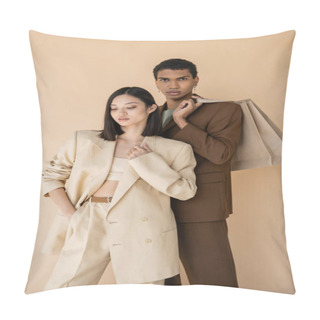 Personality  African American Man With Shopping Bags Looking At Camera Near Asian Woman In Pantsuit Isolated On Beige Pillow Covers