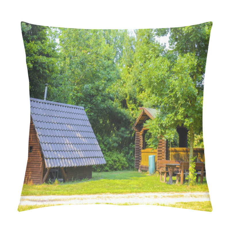 Personality  Beautiful brown wooden huts and wooden benches in the forest in Hemmoor Hechthausen Cuxhaven Lower Saxony Germany. pillow covers