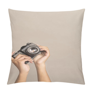 Personality  Hands Holding A Camera On A Gray Background. Analog Film Camera Pillow Covers