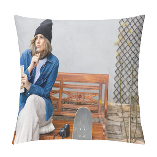 Personality  An Artist In A Contemplative Mood, Pen In Mouth, Pauses Thoughtfully With Her Notebook And Smartphone, Embodying The Essence Of Urban Inspiration. Pillow Covers