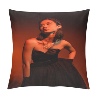 Personality  Asian Woman With Short Hair And Wet Hairstyle Posing With Hand On Hip In Black Strapless Dress With Tulle Skirt And Gloves While Standing On Orange Background With Red Lighting, Golden Jewelry  Pillow Covers