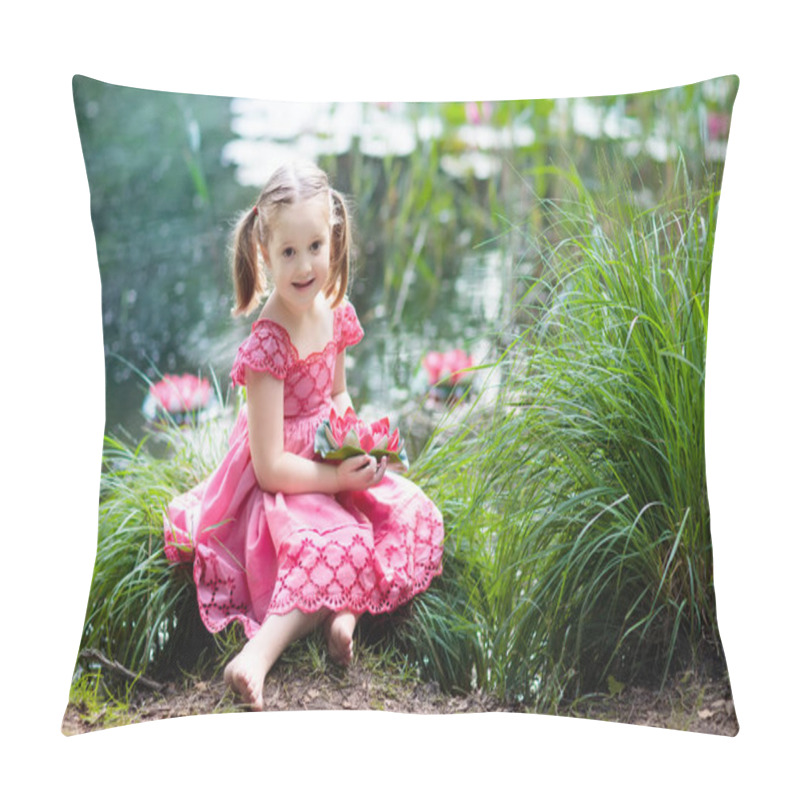 Personality  Child sitting at lake shore watching water lily flowers. Little girl holding pink lily flower. Kid looking at lilies on sunny spring day. Kids outdoor and nature fun. Wild flowers in summer park. pillow covers