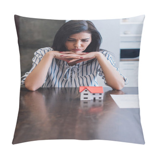 Personality  Upset And Thoughtful Woman With Clenched Hands At Table With House Model Near Document In Room Pillow Covers