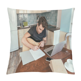 Personality  High Angle View Of Attentive Young Man With Guitar Writing On Paper While Sitting Near Laptop Pillow Covers