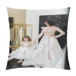 Personality  Happy Middle Eastern Woman With Brunette Wavy Hair In Stunning Wedding Dress Holding Hands With Daughter In Cute Floral Attire While Standing In Bridal Salon, Shopping, Golden Accents Pillow Covers