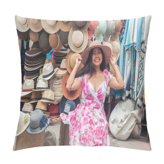 Personality  A Cheerful Young Woman Is Trying On A Stylish Wide-brimmed Hat At A Colorful Hat Stall In An Outdoor Marketplace, Radiating Joy And Satisfaction. High Quality Photo Pillow Covers