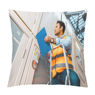 Personality  Handsome, Concentrated Indian Warehouse Worker Standing On Ladder And Holding Clipboard Pillow Covers