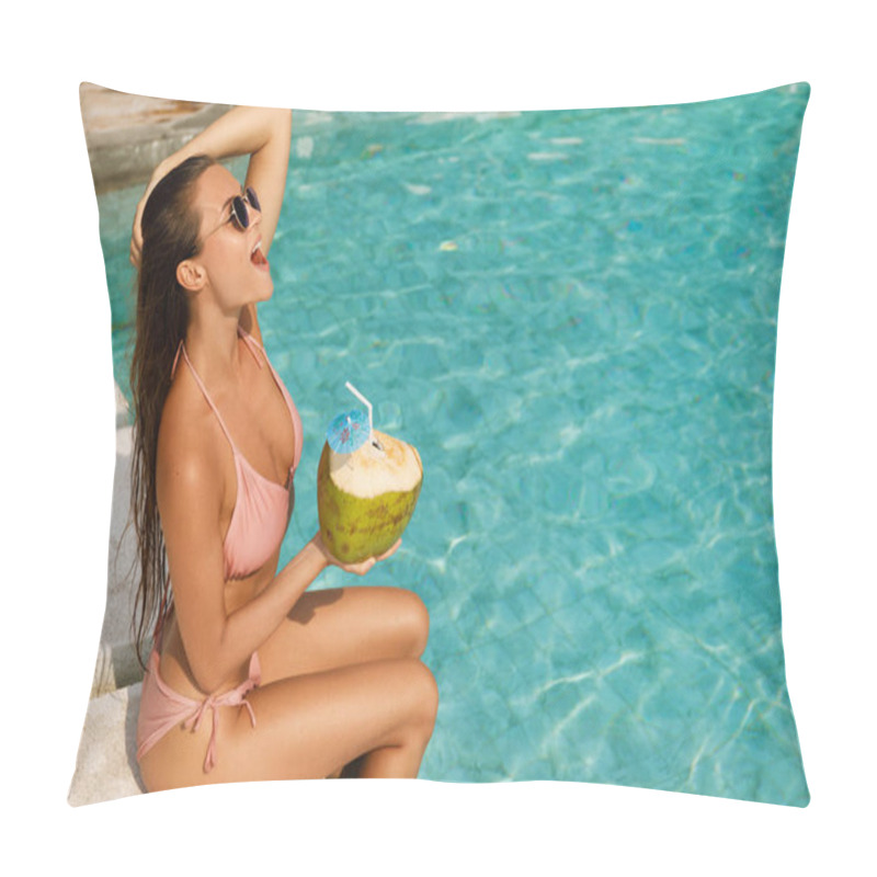 Personality  Happy woman relaxing in the swimming pool and drinking coconut water pillow covers
