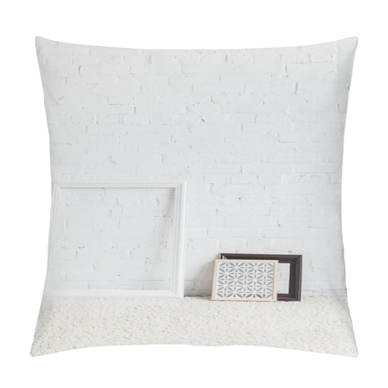 Personality  picture frames with leaning on white brick wall, mockup concept pillow covers