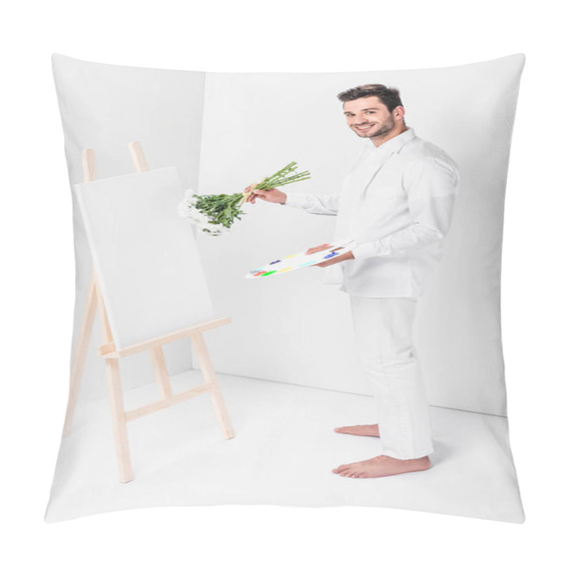 Personality  barefoot male artist in total white drawing on easel with bouquet of flowers pillow covers
