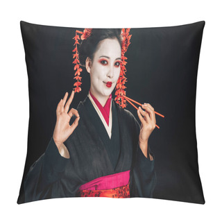 Personality  Smiling Beautiful Geisha In Black Kimono With Red Flowers In Hair Holding Chopsticks And Showing Okay Sign Isolated On Black Pillow Covers