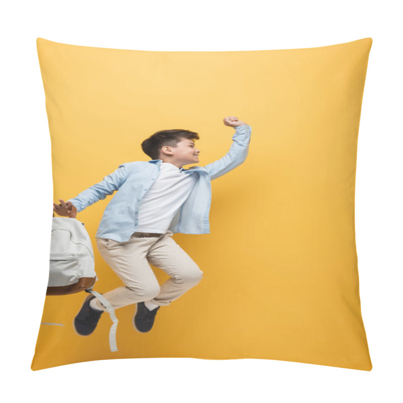 Personality  Side View Of Asian Schoolboy Holding Backpack And Jumping Isolated On Yellow  Pillow Covers