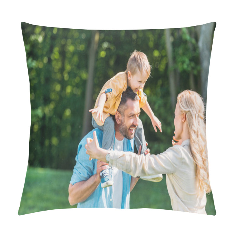 Personality  happy parents with adorable little son spending time together in park pillow covers