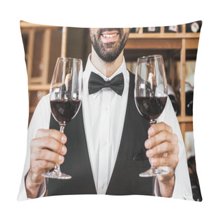 Personality  Cropped Shot Of Smiling Young Sommelier Holding Two Glasses Of Red Wine At Wine Store Pillow Covers