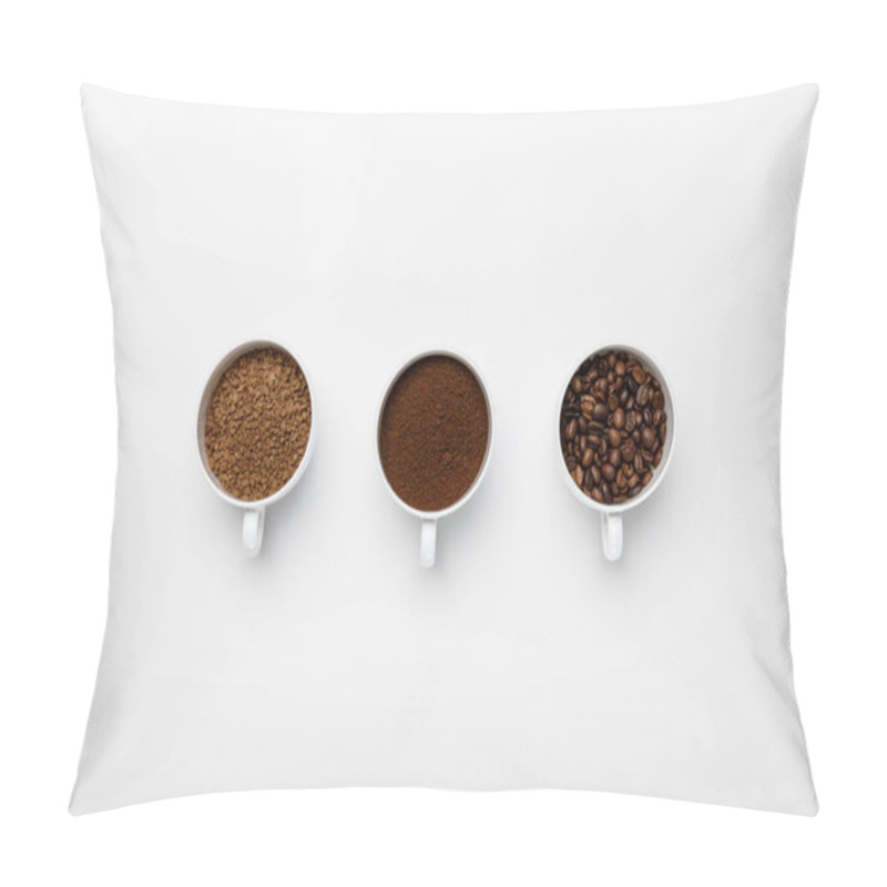 Personality  flat lay with three types of coffee grinding in cups on white background with copy space pillow covers