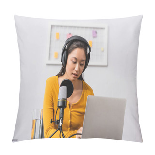 Personality  Concentrated Asian Radio Host In Wireless Headphones Using Laptop Near Microphone In Studio Pillow Covers
