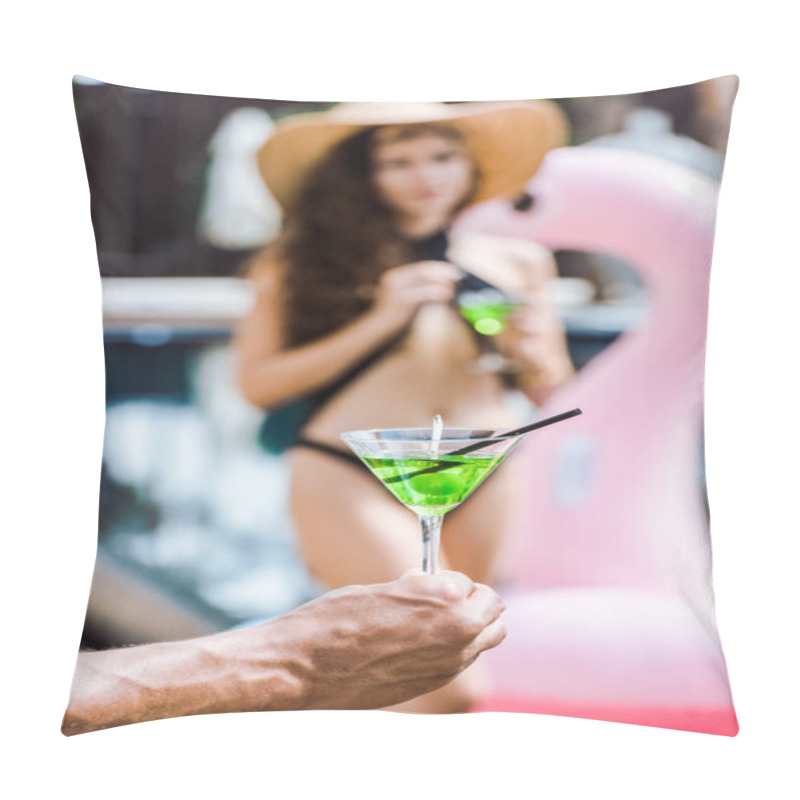 Personality  cropped image of boyfriend holding glass of cocktails near girlfriend in swimsuit pillow covers