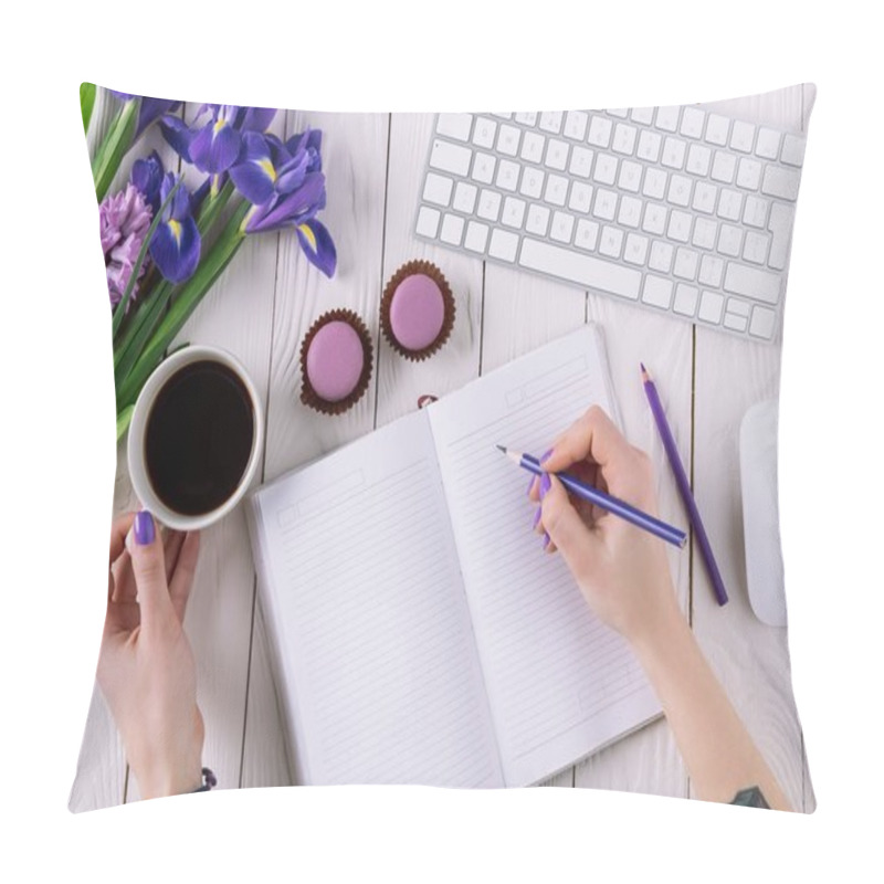 Personality  cropped shot of woman writing in notebook at workplace pillow covers