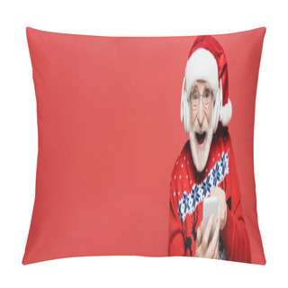 Personality  Cheerful Senior Man In Santa Hat And Headphones Using Smartphone Isolated On Red, Banner  Pillow Covers