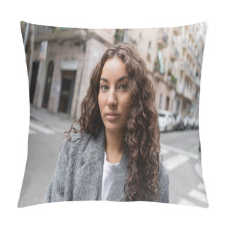 Personality  Portrait Of Young And Curly Brunette Woman In Casual Grey Jacket Standing On Blurred Urban Street With Buildings At Background At Daytime In Barcelona, Spain  Pillow Covers