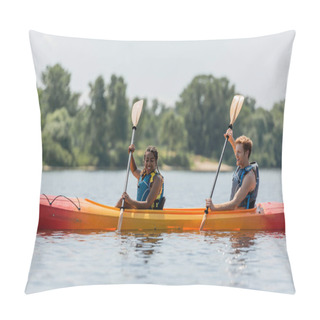Personality  Joyful And Active Interracial Couple In Life Vests Paddling In Sportive Kayak While Spending Time On Lake With Blurred Green Shore During Summer Vacation Pillow Covers