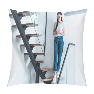Personality  Woman Using Smartphone While Standing On Stairs At Home Pillow Covers