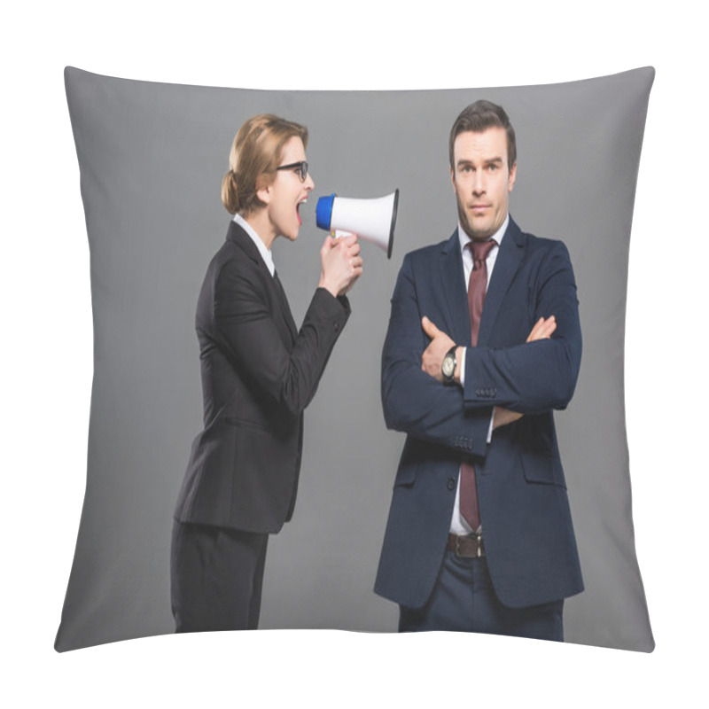 Personality  aggressive businesswoman with bullhorn yelling at businessman, isolated on grey, feminism concept pillow covers