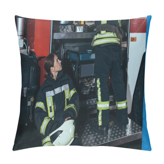 Personality  Partial View Of Female Firefighter In Helmet Looking At Colleague Checking Equipment At Fire Station Pillow Covers