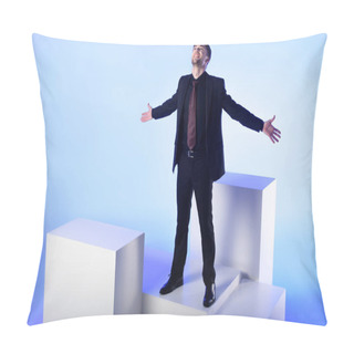 Personality  Businessman In Black Suit With Outstretched Arms Standing On White Block Isolated On Blue Pillow Covers
