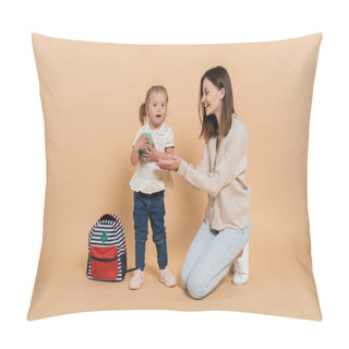 Personality  Girl With Down Syndrome Holding Small Globe Near Happy Mother And Backpack On Beige  Pillow Covers