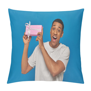 Personality  Excited African American Man Holding Wrapped Present On Blue Background, Festive Occasions Pillow Covers